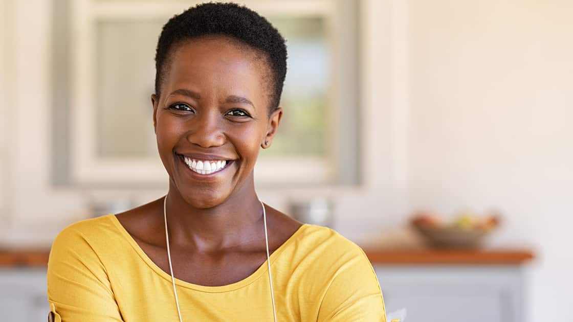 Beautiful Woman Smiling in Kitchen Photo