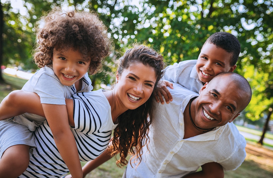 Smiling Family Outdoors Photo