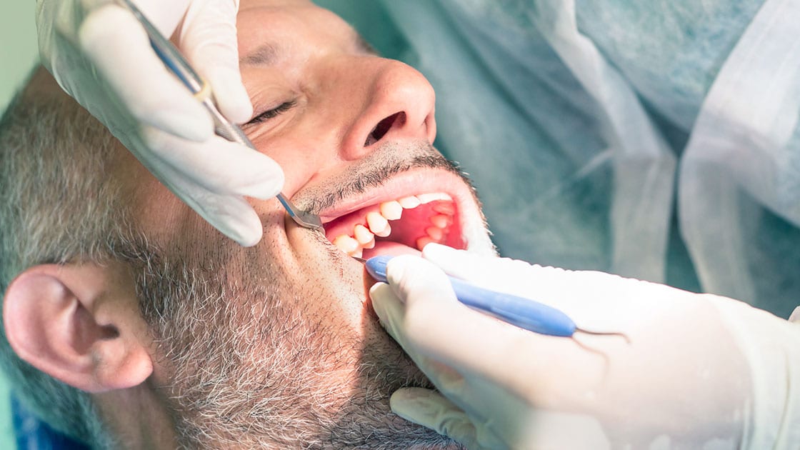 Man Receiving Dental Care Photo